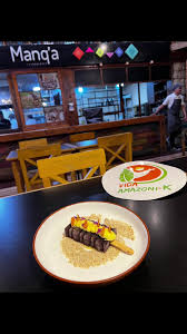 Dulce de Açai con miel de bosque y queso amazónico.